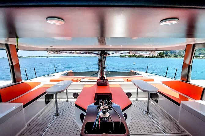 LUXURY PRIVATE Catamaran : Full-Day Sail & Polynesian Motu Lunch - Swimming near a dramatic bay