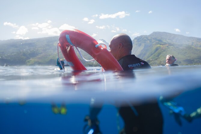 Snorkeling immersion in the wonders of Tahiti - Getting ready with mask, snorkel, and fins